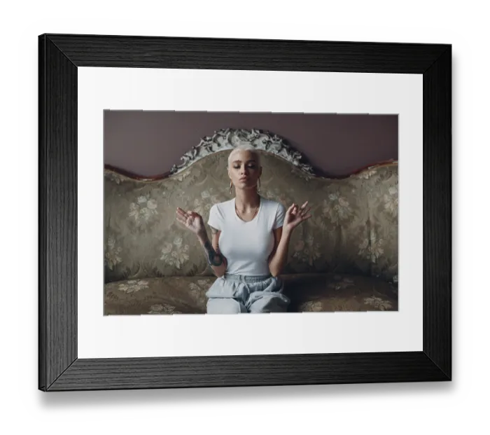 Framed Print : Millenial young woman with short blonde hair portrait sitting and meditate with ok sign mudra on vintage sofa Framed Print : Millenial young woman with short blonde hair portrait sitting and meditate with ok sign mudra on vintage sofa