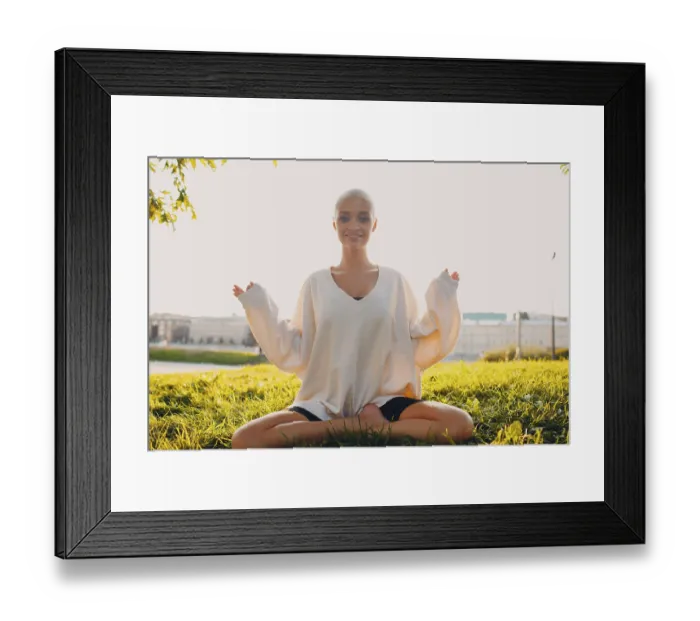 Framed Print : Portrait of young millenial european short haired woman doing yoga lotus asana on green grass meadow summer park sunset Framed Print : Portrait of young millenial european short haired woman doing yoga lotus asana on green grass meadow summer park sunset