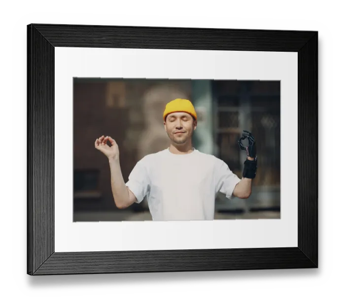 Framed Print : Disabled european man with artificial limb of hand meditating outdoors