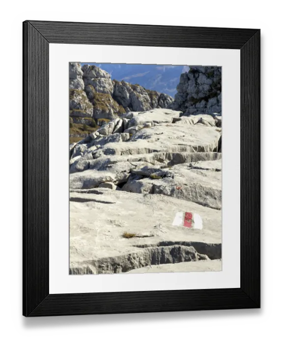 Framed Print : Hiking trail marking, trail sign on limestone