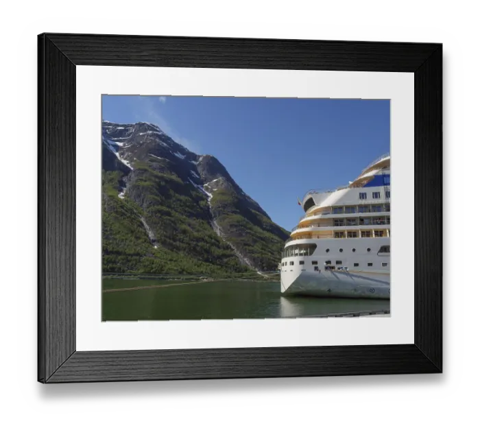Framed Print : A cruise ship against a majestic mountain backdrop with a clear blue sky