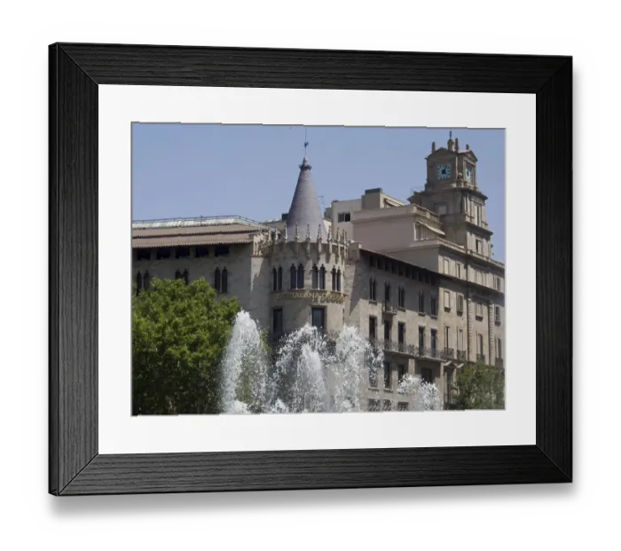 Framed Print : Historic building with a clock tower and impressive Gothic architecture in front of a fountain