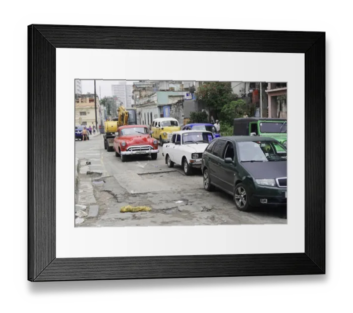 Framed Print : Various vintage and modern cars are standing in line in the city Framed Print : Various vintage and modern cars are standing in line in the city