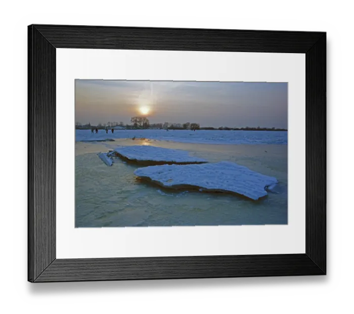 Framed Print : People walk across ice rink, sunset
