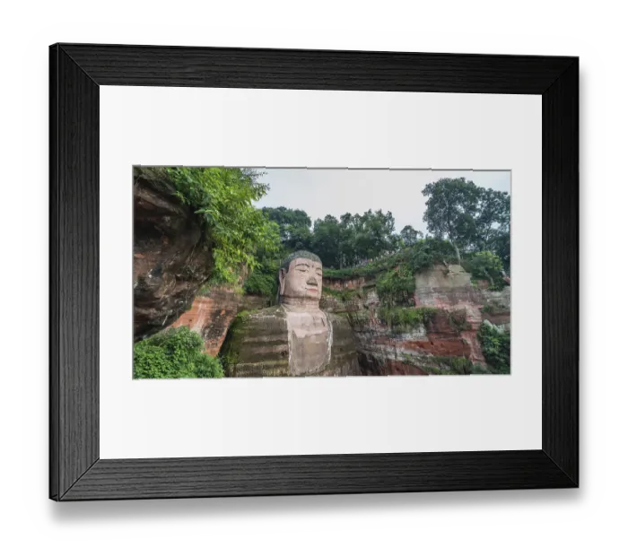 Framed Print : Leshan, China - July 2019 : The close up of the head and torso of the Giant Leshan Buddha