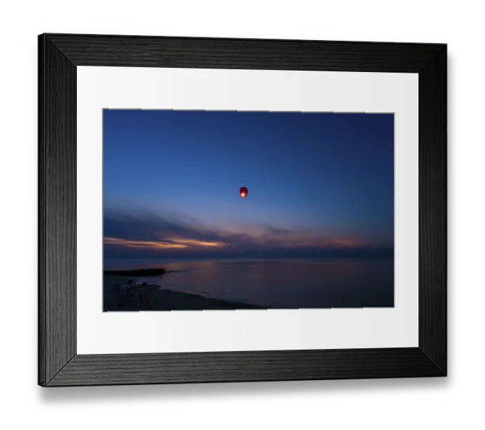 Framed Print : Chinese lantern flying over the calm sea at night Framed Print : Chinese lantern flying over the calm sea at night