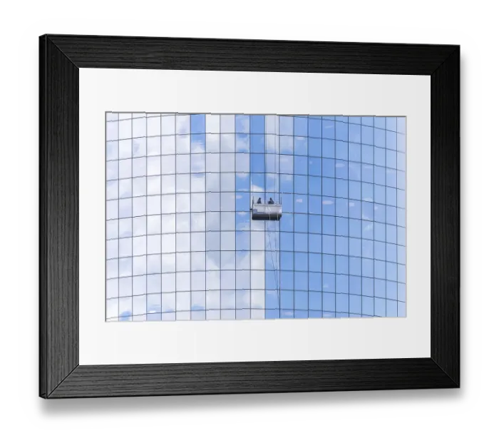 Framed Print : Two cleaners washing the windows of modern skyscraper in New York