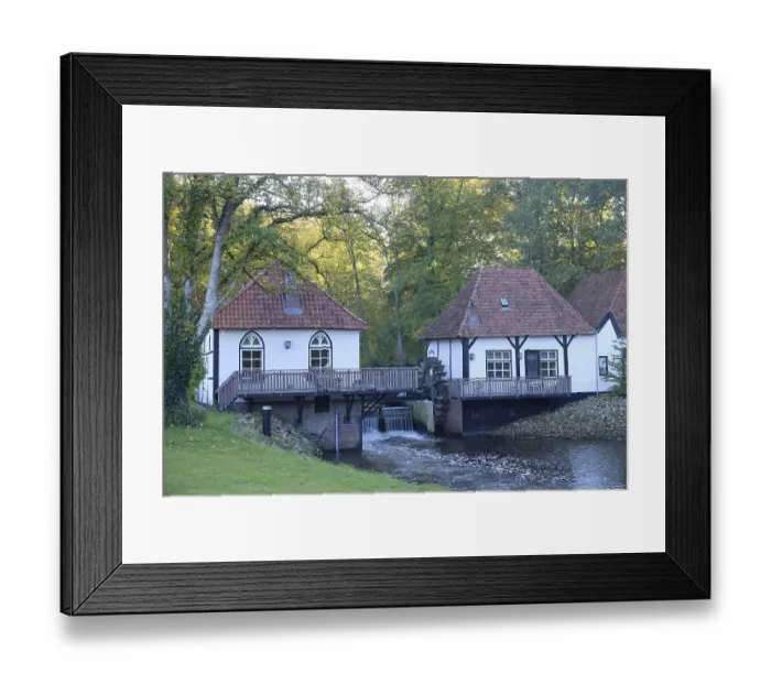 Framed Print : Two half-timbered houses on a river with a mill surrounded by trees and nature