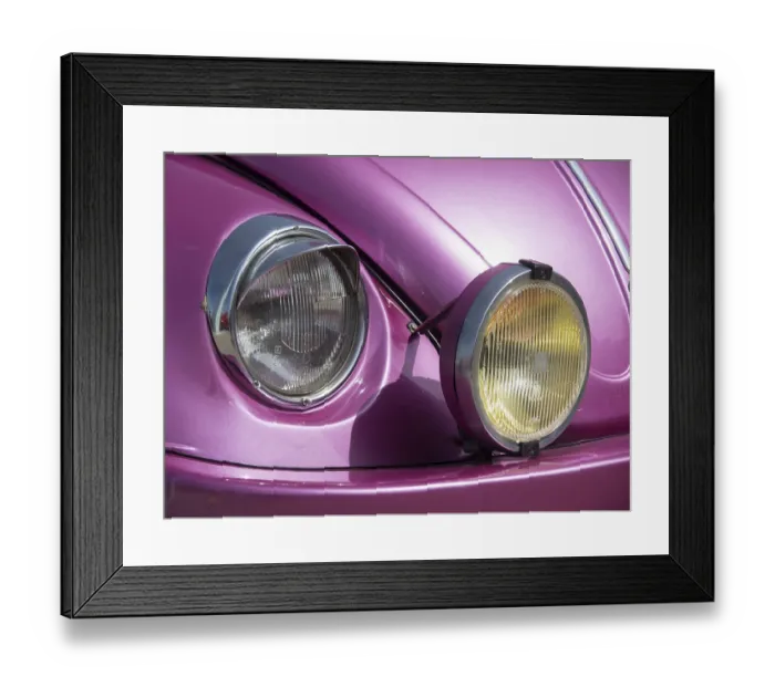 Framed Print : Close-up of the front of a pink classic car with characteristic twin headlights Framed Print : Close-up of the front of a pink classic car with characteristic twin headlights