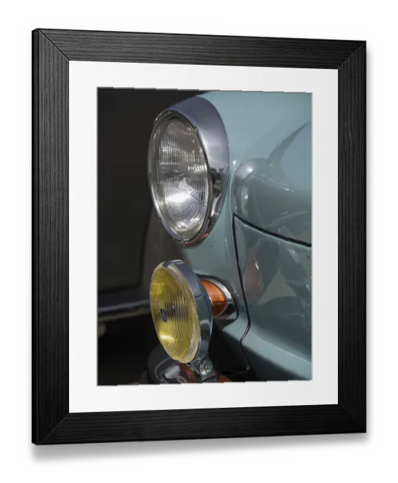 Framed Print : Close-up of a turquoise classic car with additional yellow headlights and chrome accents Framed Print : Close-up of a turquoise classic car with additional yellow headlights and chrome accents