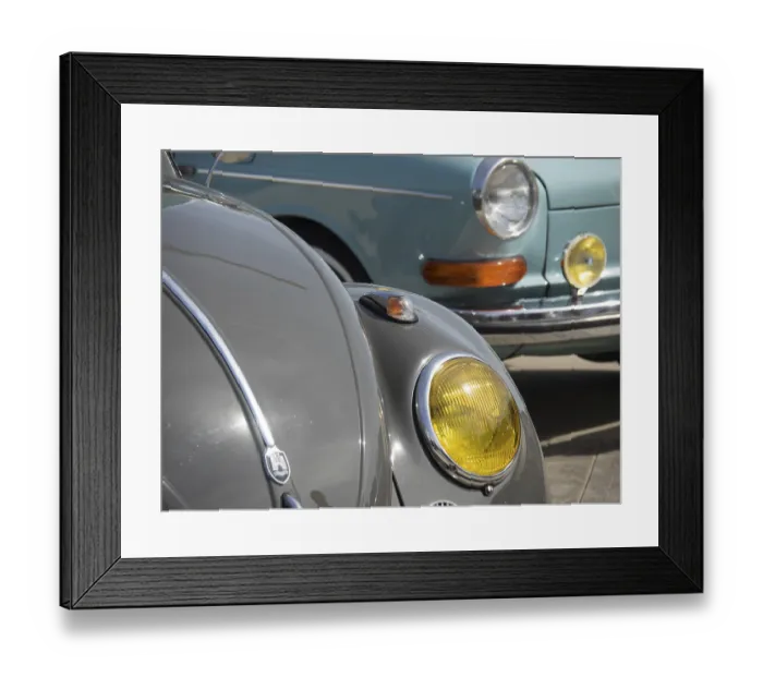 Framed Print : Close-up of a grey vintage car with yellow headlights