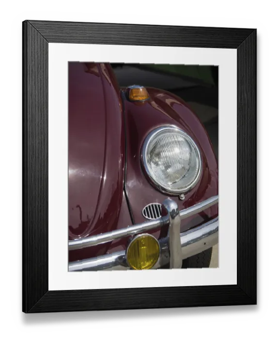 Framed Print : Close-up of a red vintage car with shiny headlight and bumper