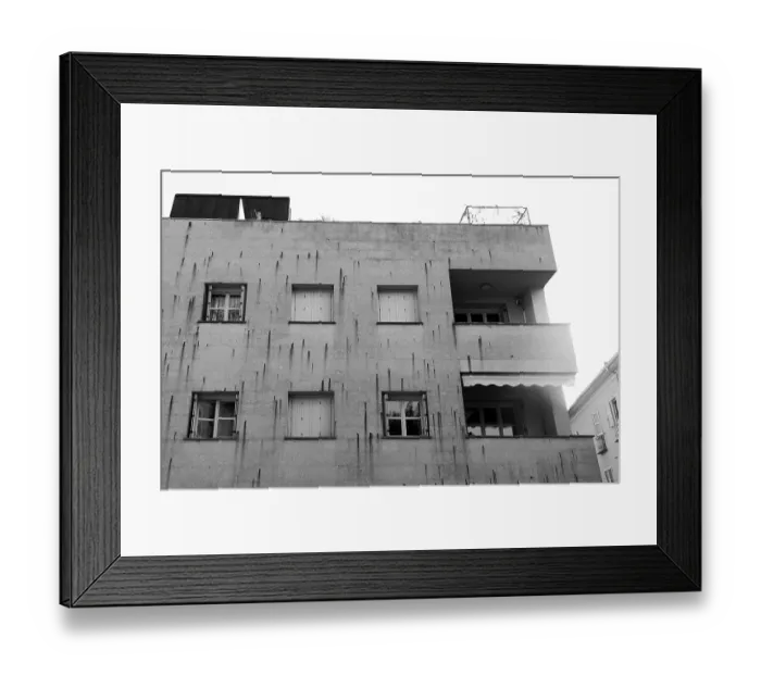 Framed Print : A modern concrete building with multiple windows and balconies Framed Print : A modern concrete building with multiple windows and balconies