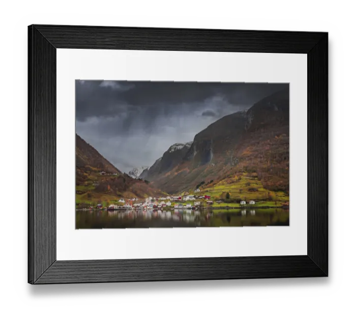 Framed Print : Small homes on the shore of a fjord photographed from a Fjords sightseeing cruise boat in autumn