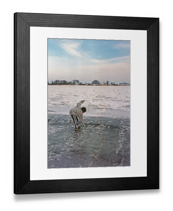 Framed Print : Boy on ice rink, frozen Elbe, Bleckede