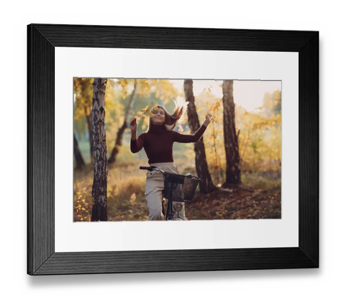 Framed Print : Happy active young woman riding vintage bicycle in autumn park at sunset Framed Print : Happy active young woman riding vintage bicycle in autumn park at sunset