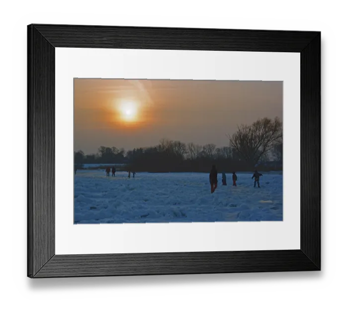 Framed Print : People walk across ice rink, sunset