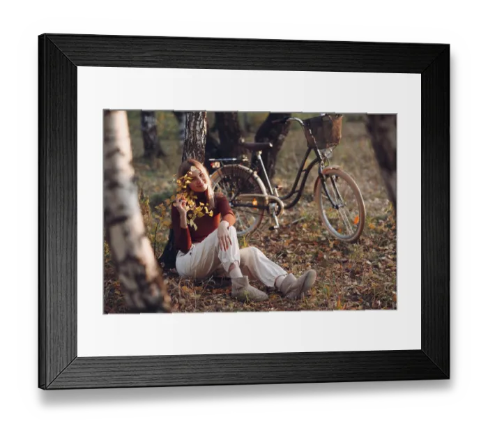 Framed Print : Happy active young woman riding vintage bicycle in autumn park at sunset Framed Print : Happy active young woman riding vintage bicycle in autumn park at sunset