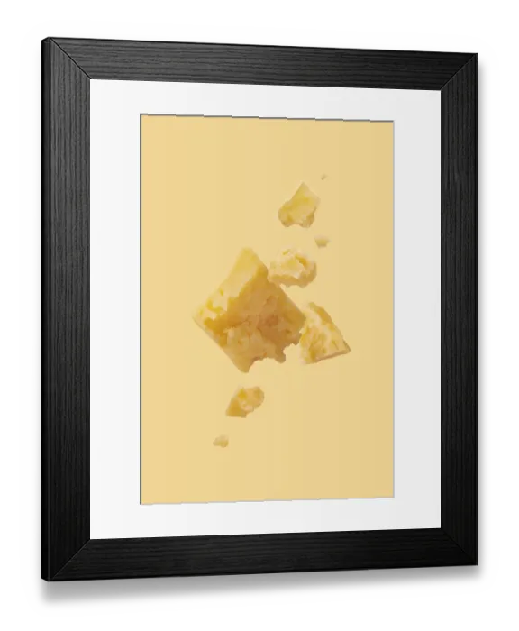 Framed Print : Pieces of cheese on a yellow background Framed Print : Pieces of cheese on a yellow background