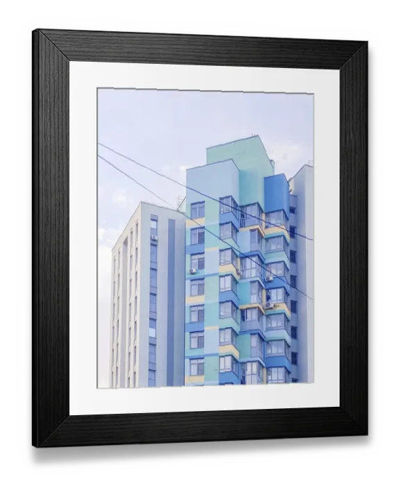 Framed Print : Multi-story residential building in blue and yellow colors Framed Print : Multi-story residential building in blue and yellow colors