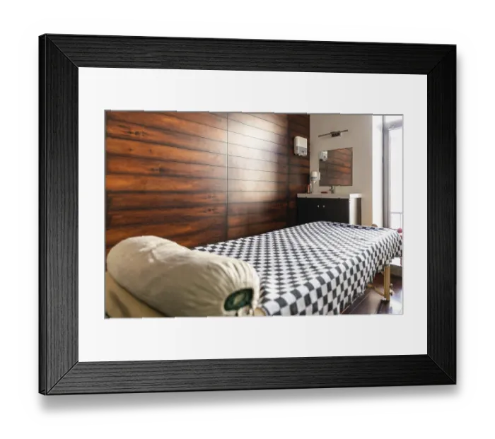 Framed Print : Wooden sticks for sound therapy with singing bowls in spa salon