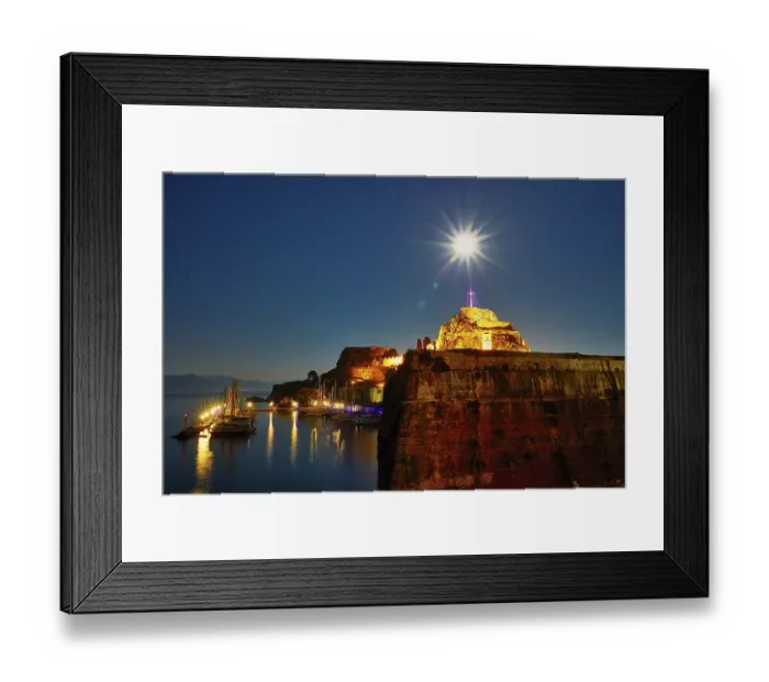 Framed Print : Old fortress, illuminated fortress at night with cross and starry sky over quiet harbor