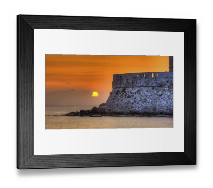 Framed Print : Agios Nikolaos fortress, sunrise behind an old castle wall with gentle sea waves Framed Print : Agios Nikolaos fortress, sunrise behind an old castle wall with gentle sea waves