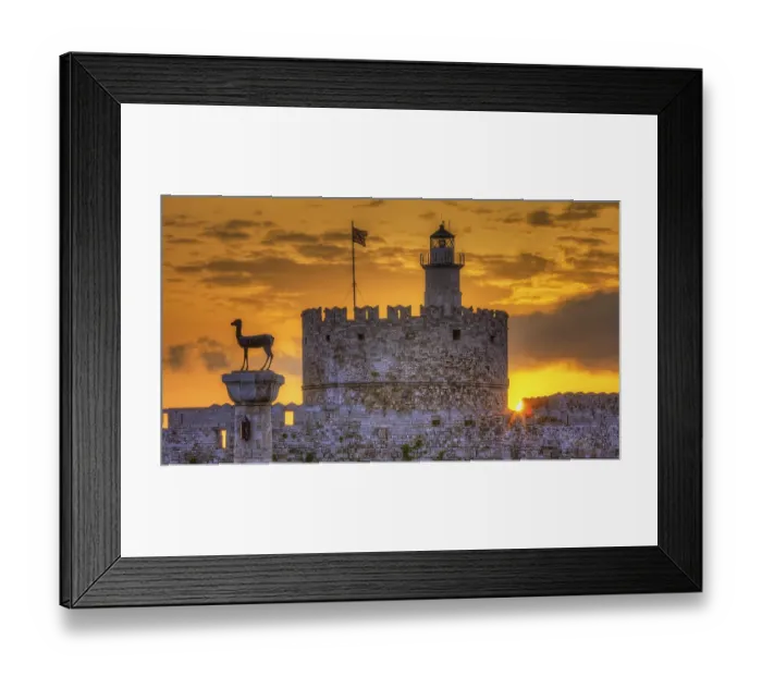 Framed Print : Agios Nikolaos fortress, historic castle with statue in front of a warm sunrise sky