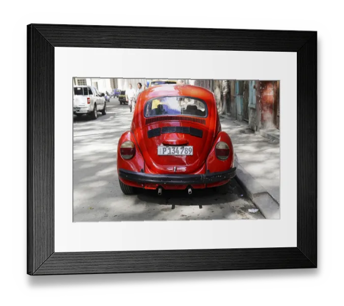 Framed Print : The rear view of a vintage red VW Beetle car on an urban road