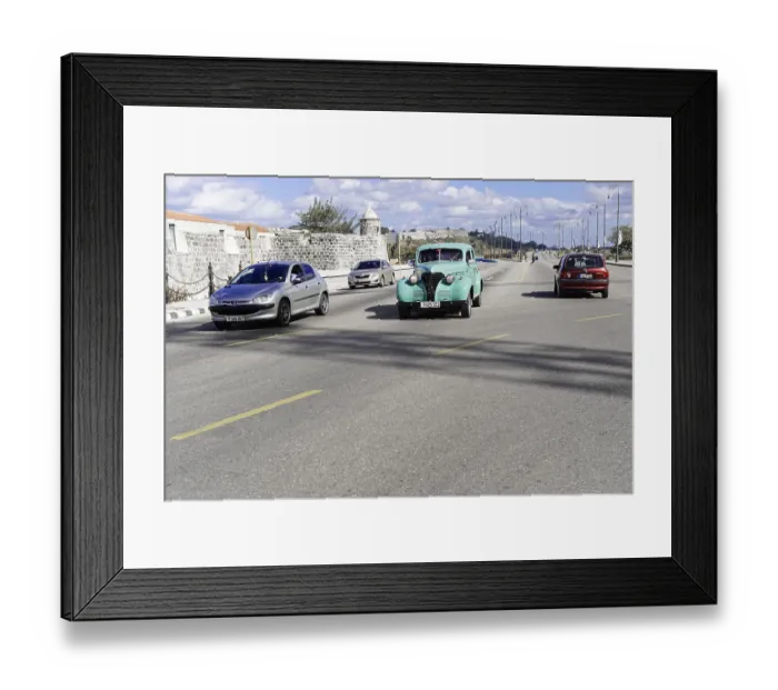 Framed Print : Several cars, including a vintage car