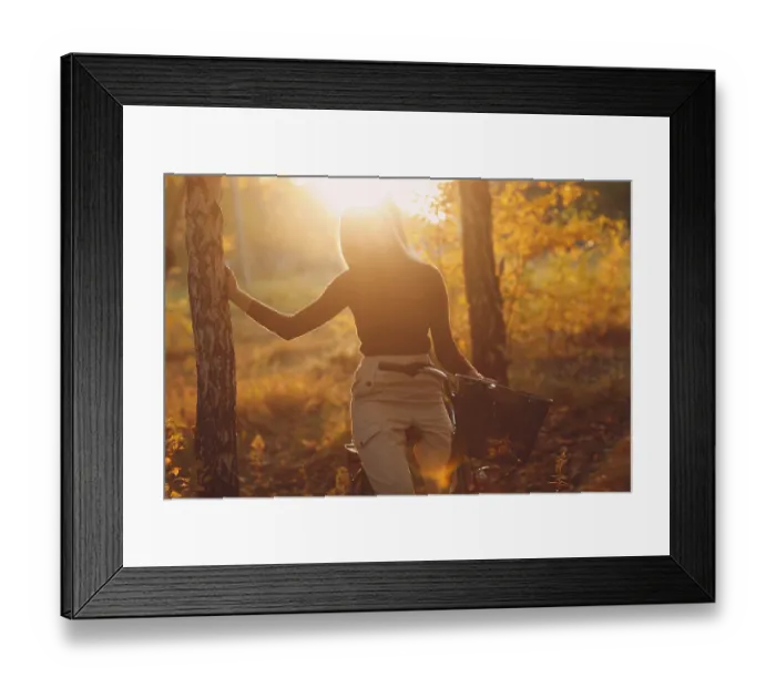 Framed Print : Happy active young woman riding vintage bicycle in autumn park at sunset