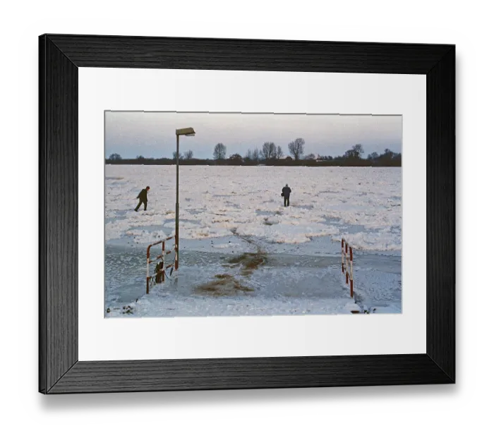 Framed Print : People walk across ice rink, ferry dock