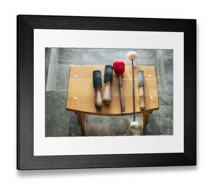 Framed Print : Wooden sticks for sound therapy with singing bowls in spa salon