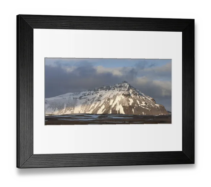 Framed Print : Typical Icelandic landscape with mountains and meadow land covered in snow at snaefellsnes peninsula in Iceland