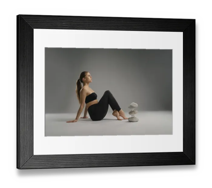Framed Print : A woman sits relaxed on the floor