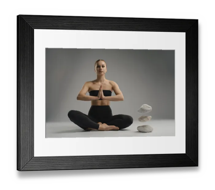 Framed Print : A woman sits cross-legged in a calm environment