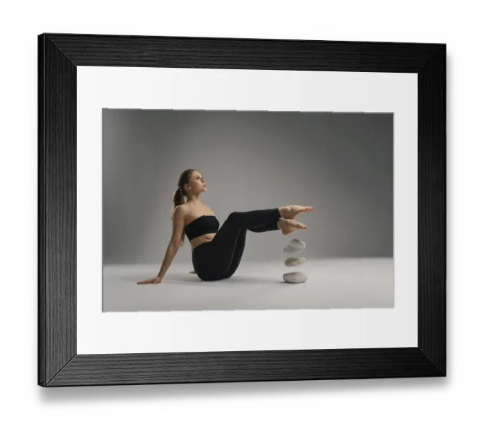 Framed Print : A young woman sits on a smooth surface