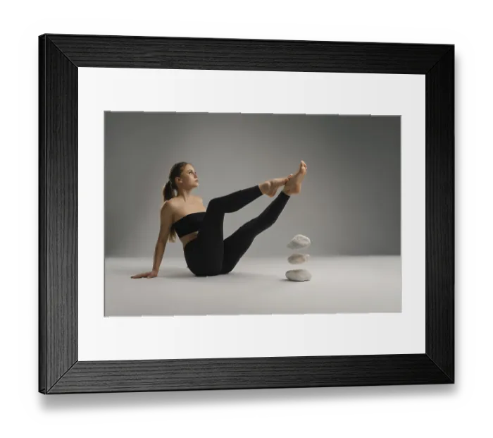 Framed Print : A focused individual performs a yoga pose