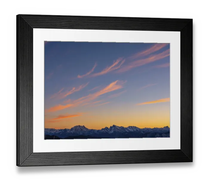 Framed Print : Red-colored plume clouds over the Berchtesgaden Alps at dusk