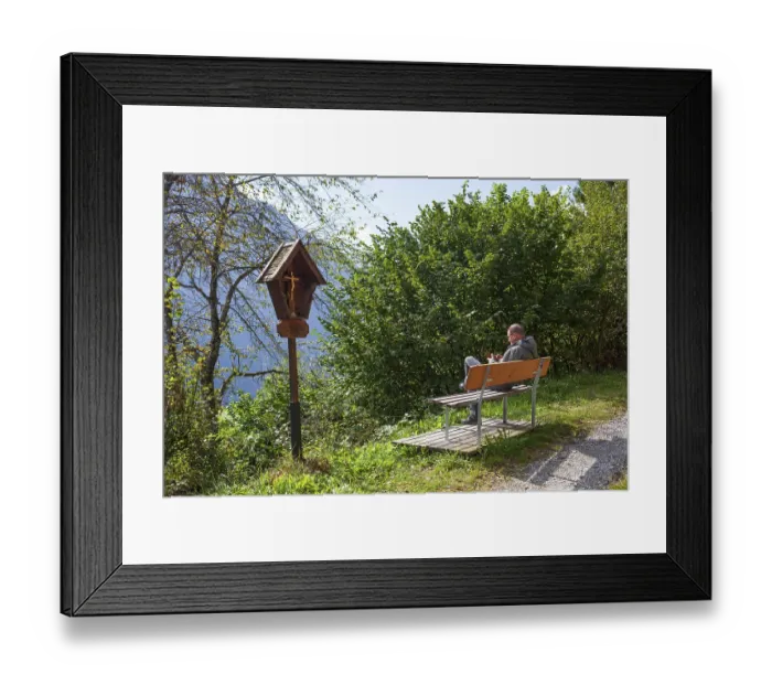 Framed Print : Hiking trail with bench, hikers