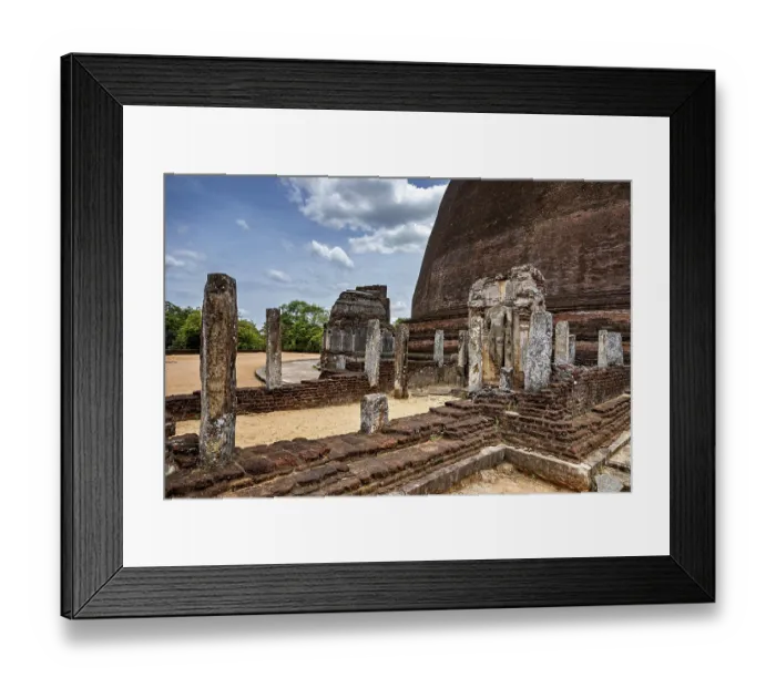 Framed Print : Architectural details and ruins of an ancient site next to a large stupa