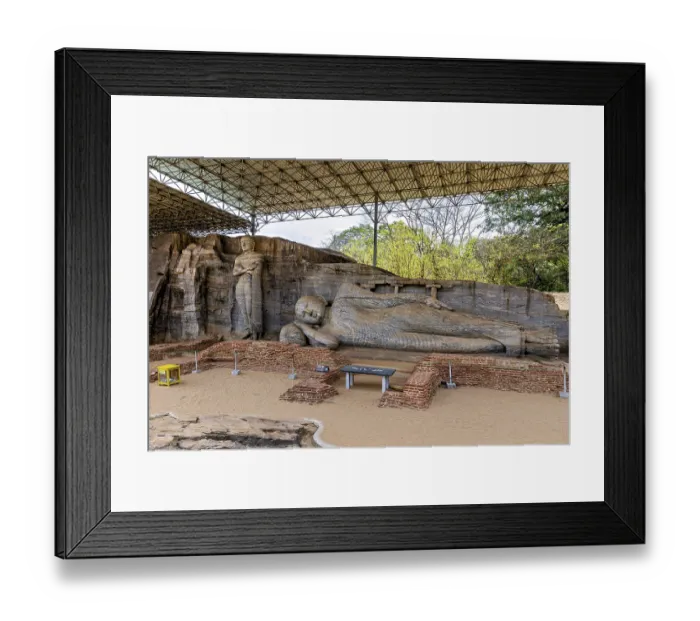 Framed Print : Panoramic view of a large reclining Buddha statue with a figure standing next to it under a protective canopy Framed Print : Panoramic view of a large reclining Buddha statue with a figure standing next to it under a protective canopy