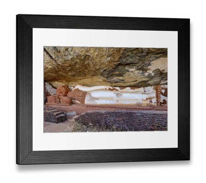 Framed Print : Reclining Buddha embedded in a rock wall