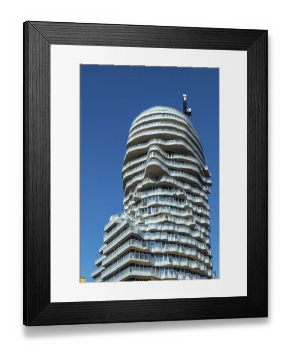 Framed Print : Modern glass facade with curved balconies on high-rise building
