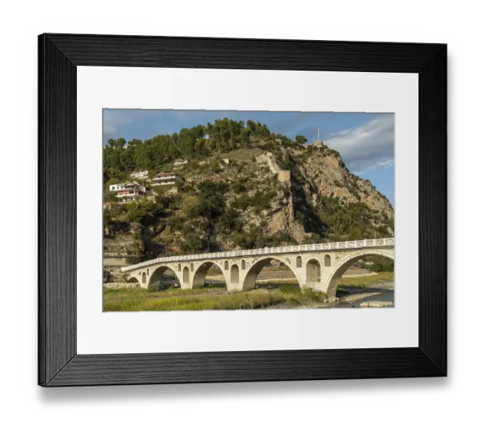 Framed Print : Steep fortress with old city wall across river bridge