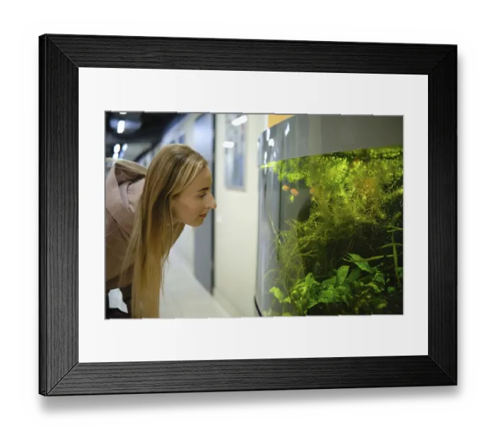 Framed Print : A woman with long hair leans forward