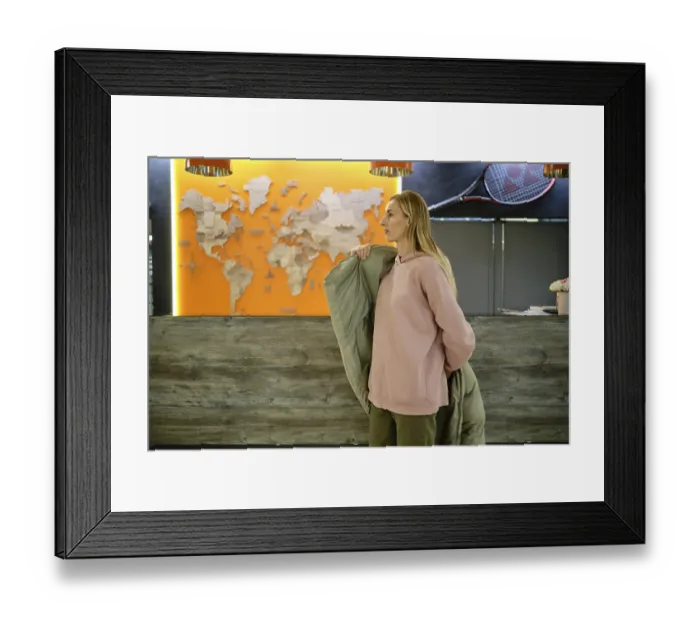 Framed Print : A woman stands at a reception area