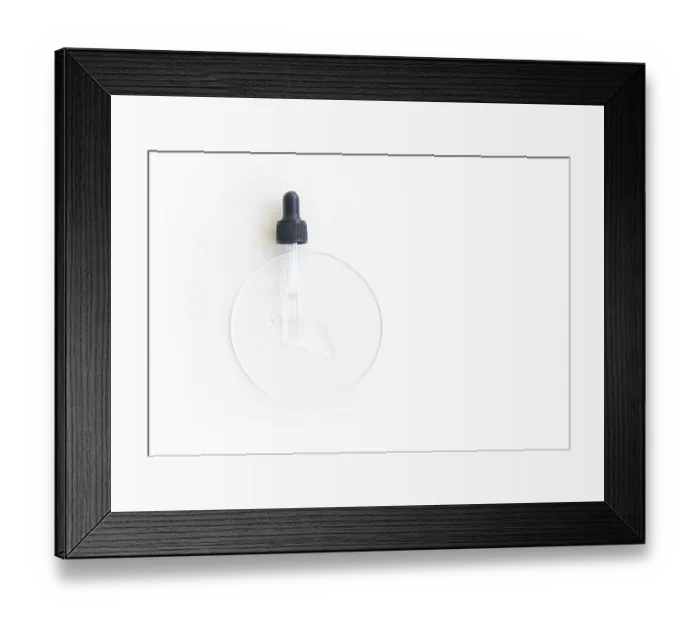 Framed Print : Transparent serum dropper on white surface with clear liquid for skincare and beauty treatments