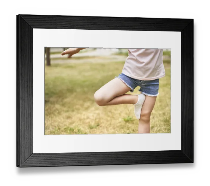 Framed Print : Pretty face. Red hair. Cute school child doing yoga exercise