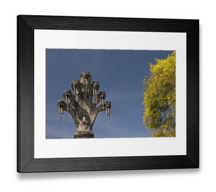 Framed Print : Monumental depiction of Buddha meditating under the protection of a seven-headed naga snake
